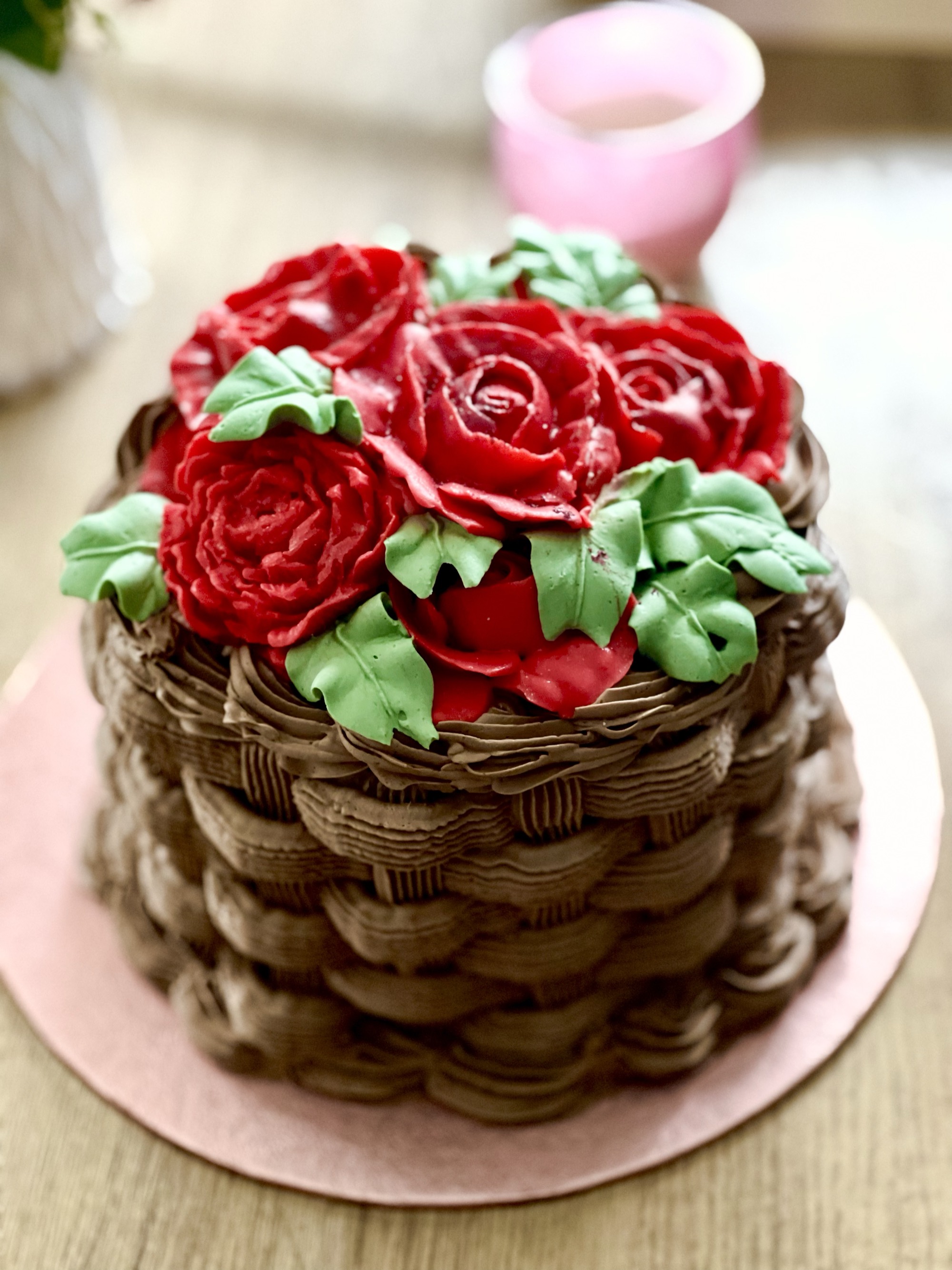 Basket-weave cake topped with red buttercream roses